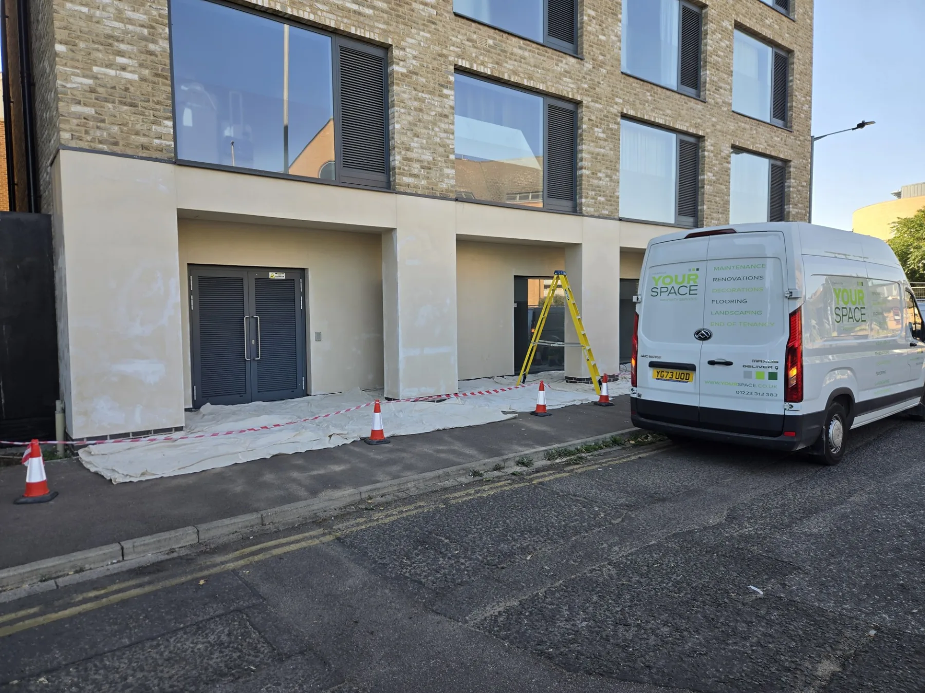 Exterior decorating work in progress at a residential building